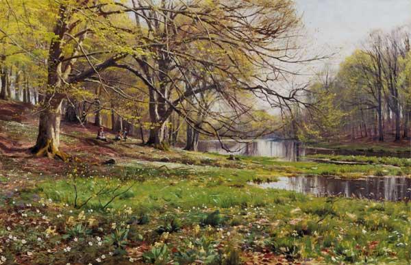 Riverside in spring with playing children