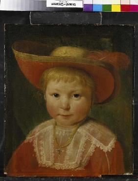 Portrait of a boy with a red fed straw hat.