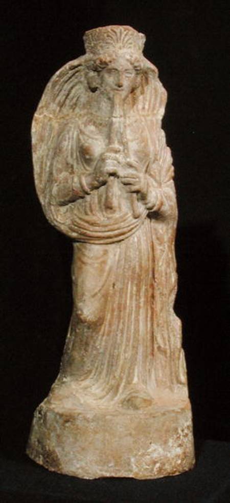 Statuette of a woman playing a double flute, from Tunisia de Punic