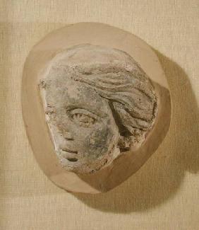 Relief depicting the head of a woman, from Tunisia