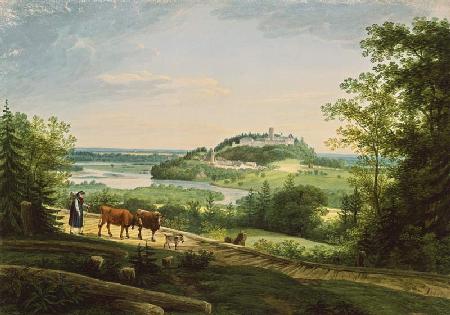 Farmer with cows in front of castle Neubeuern at t