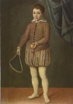 Portrait of a boy holding a tennis racket and ball