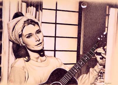 Audrey Hepburn toca la guitarra