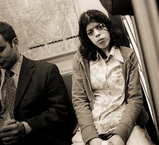 Woman sitting on a subway and staring, 2004 (b/w photo)  de Stephen  Spiller