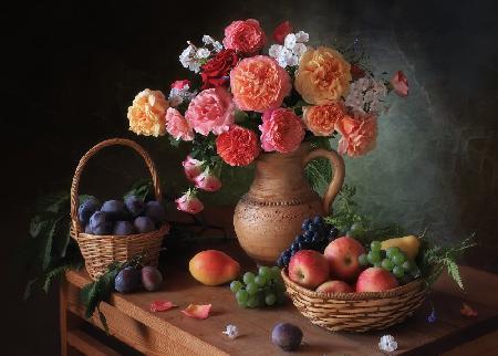 Still life with flowers and autumn fruits