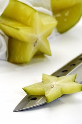 Die Sternfrucht mit Messer de Thomas Haupt
