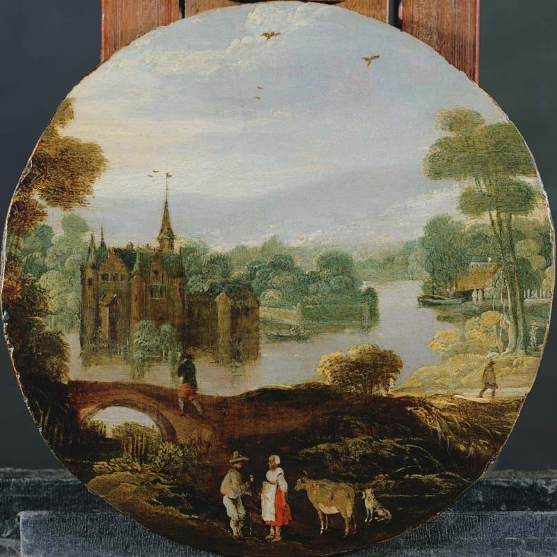 A wooded river landscape with a castle and travellers conversing de Tobias Verhaecht