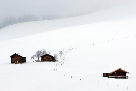 Three huts, snow